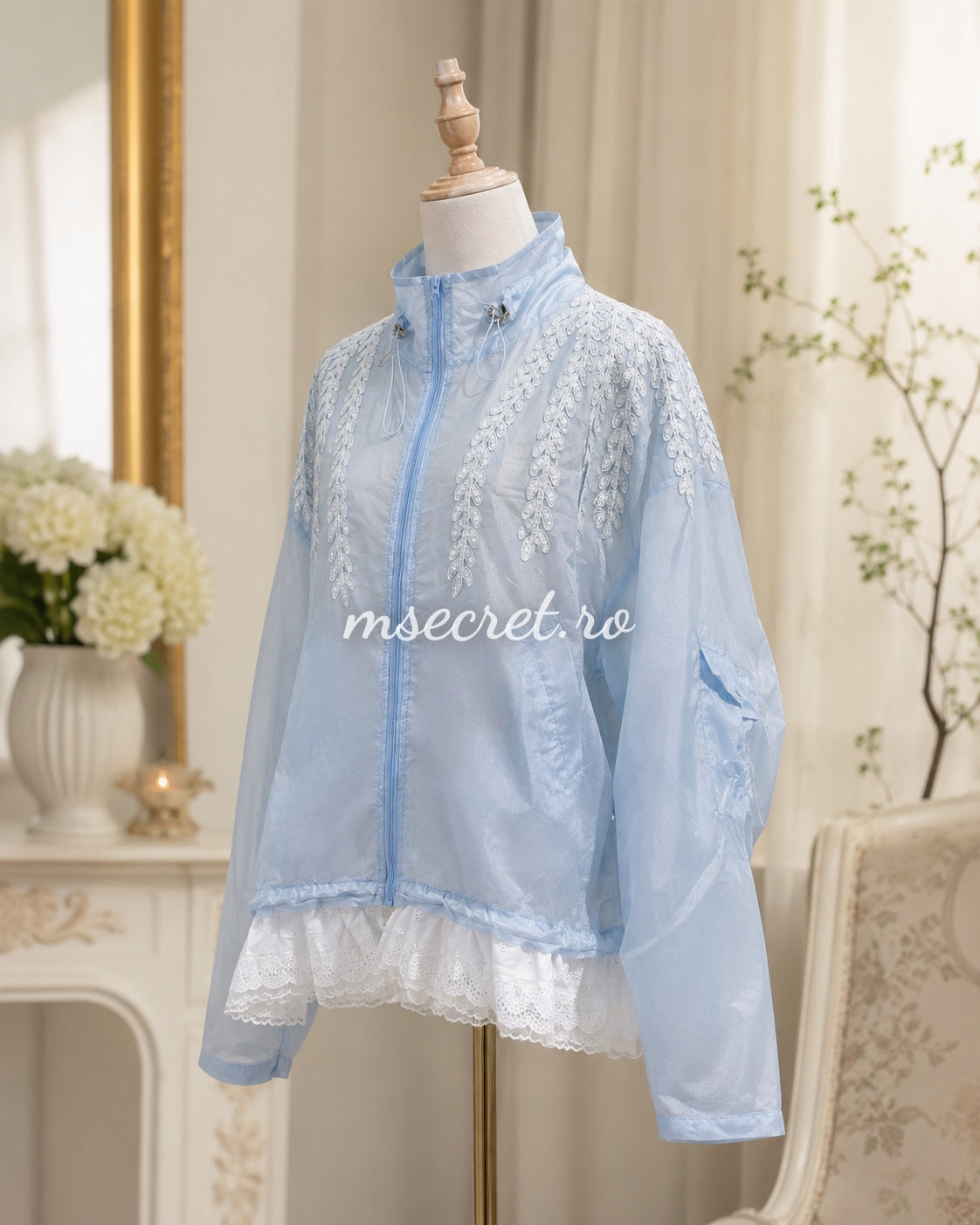 Blue jacket with floral embroidery and tulle ruffles