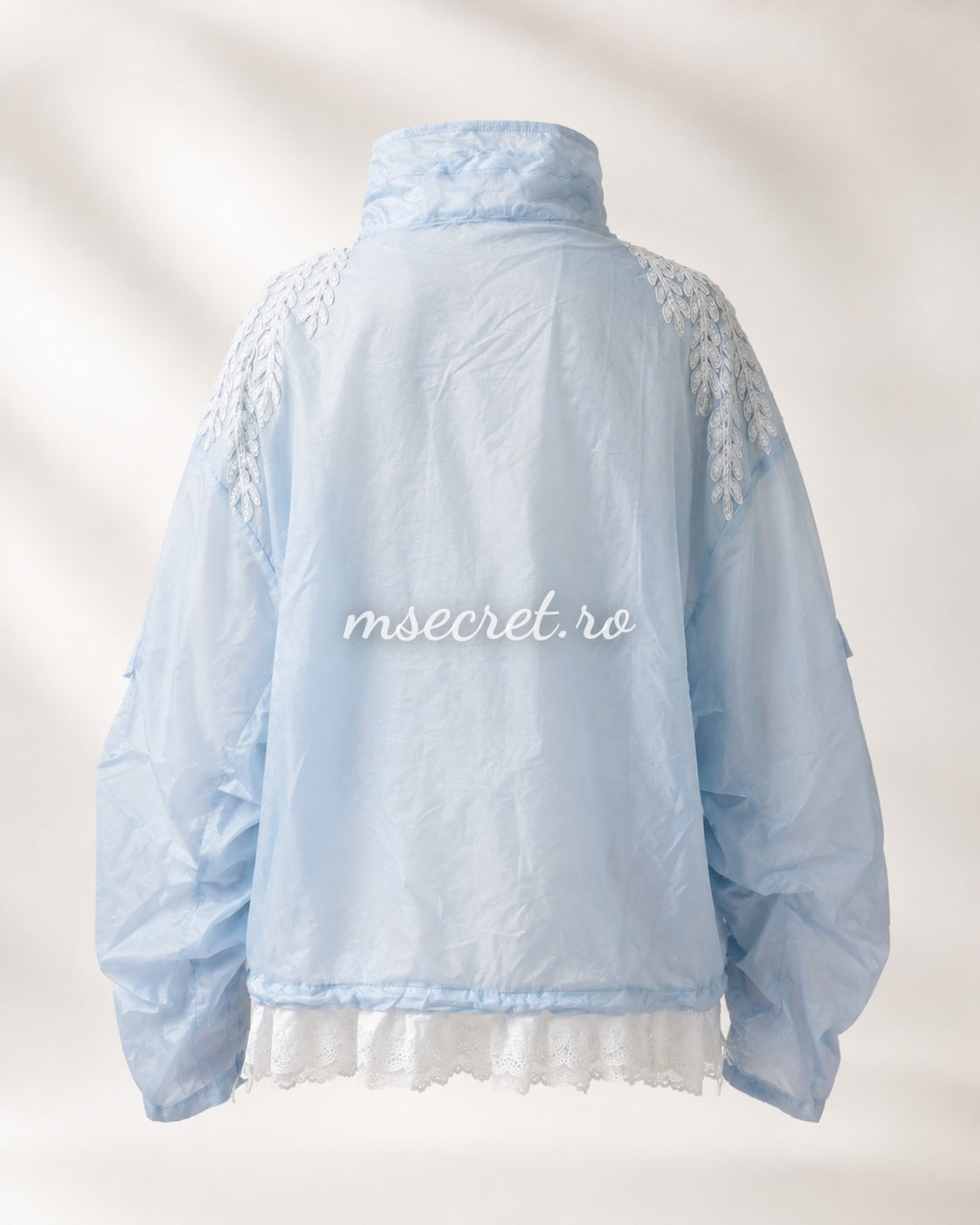 Blue jacket with floral embroidery and tulle ruffles