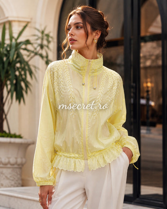 Yellow jacket with floral embroidery and tulle ruffles