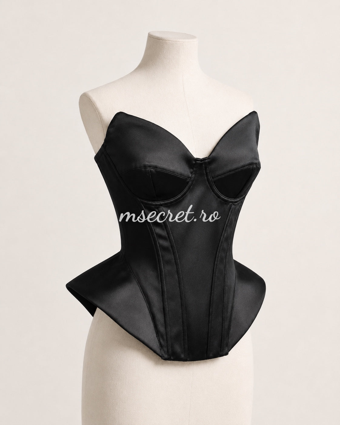 Black satin corset with contoured cups and sculptural design