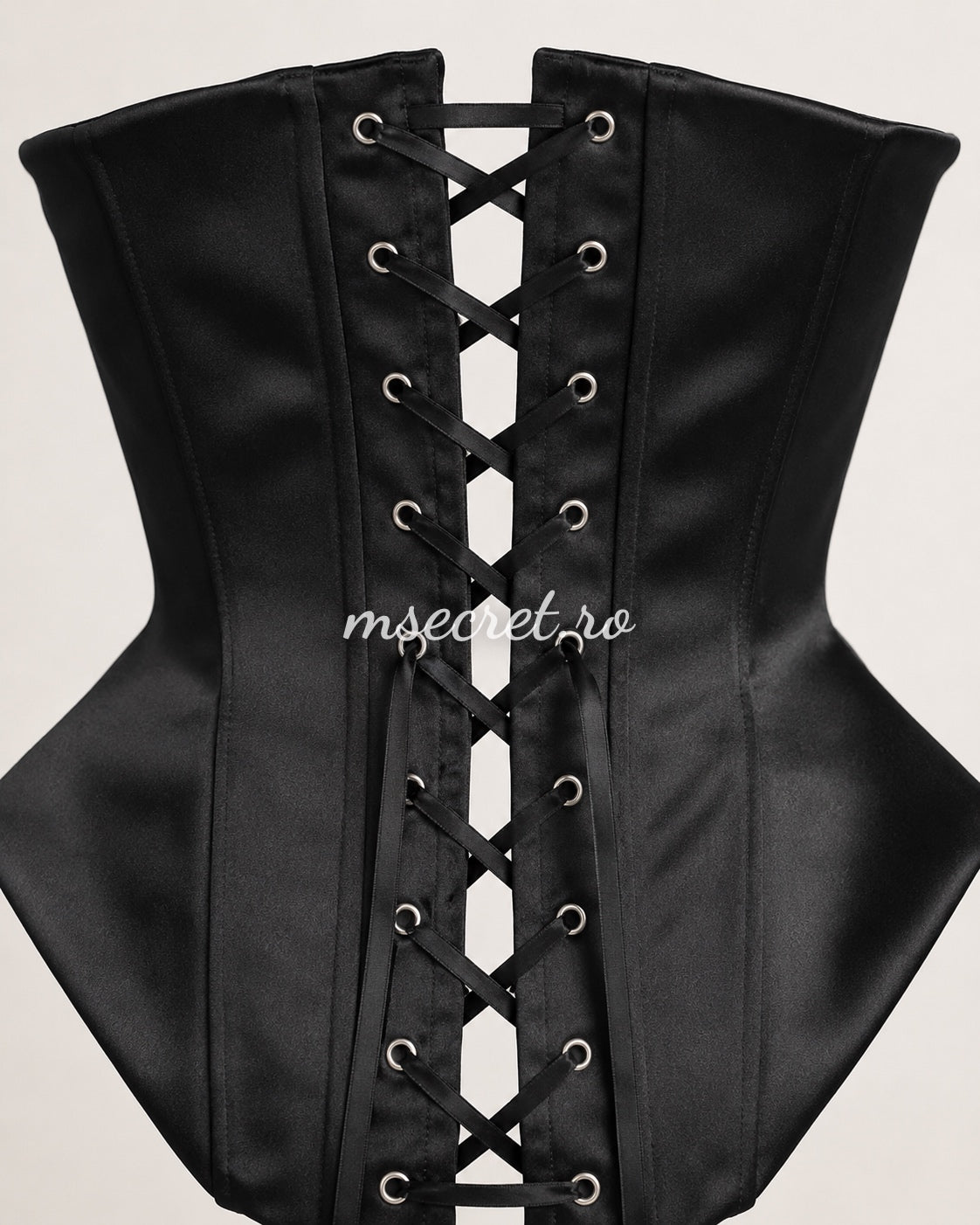 Black satin corset with contoured cups and sculptural design