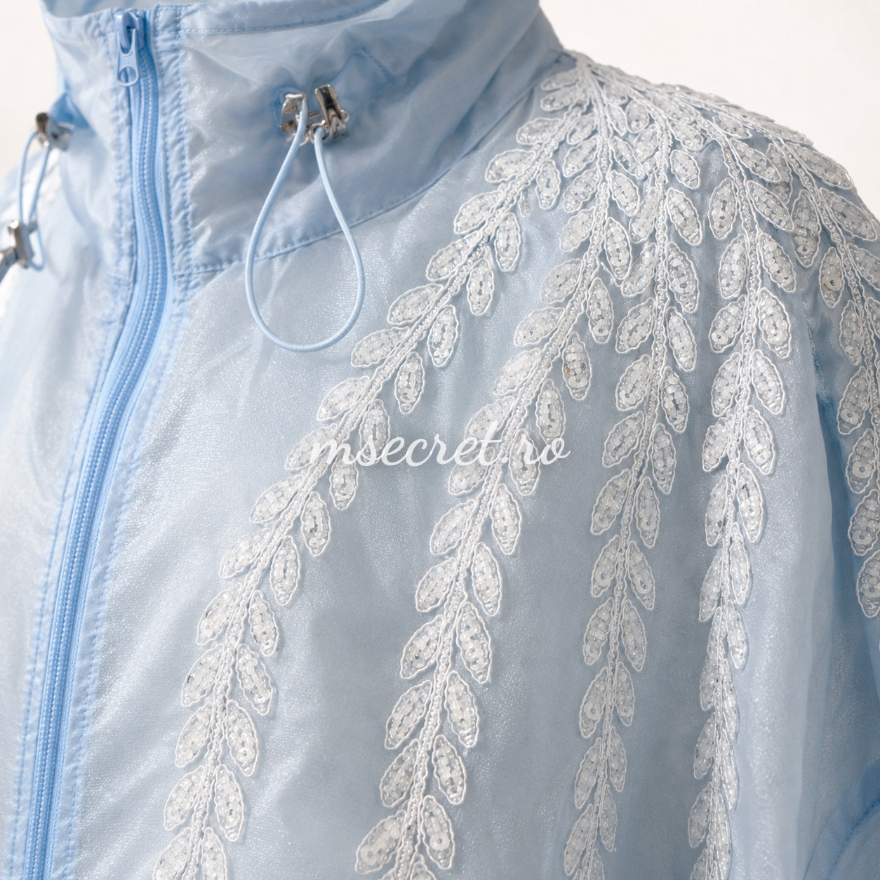 Blue jacket with floral embroidery and tulle ruffles