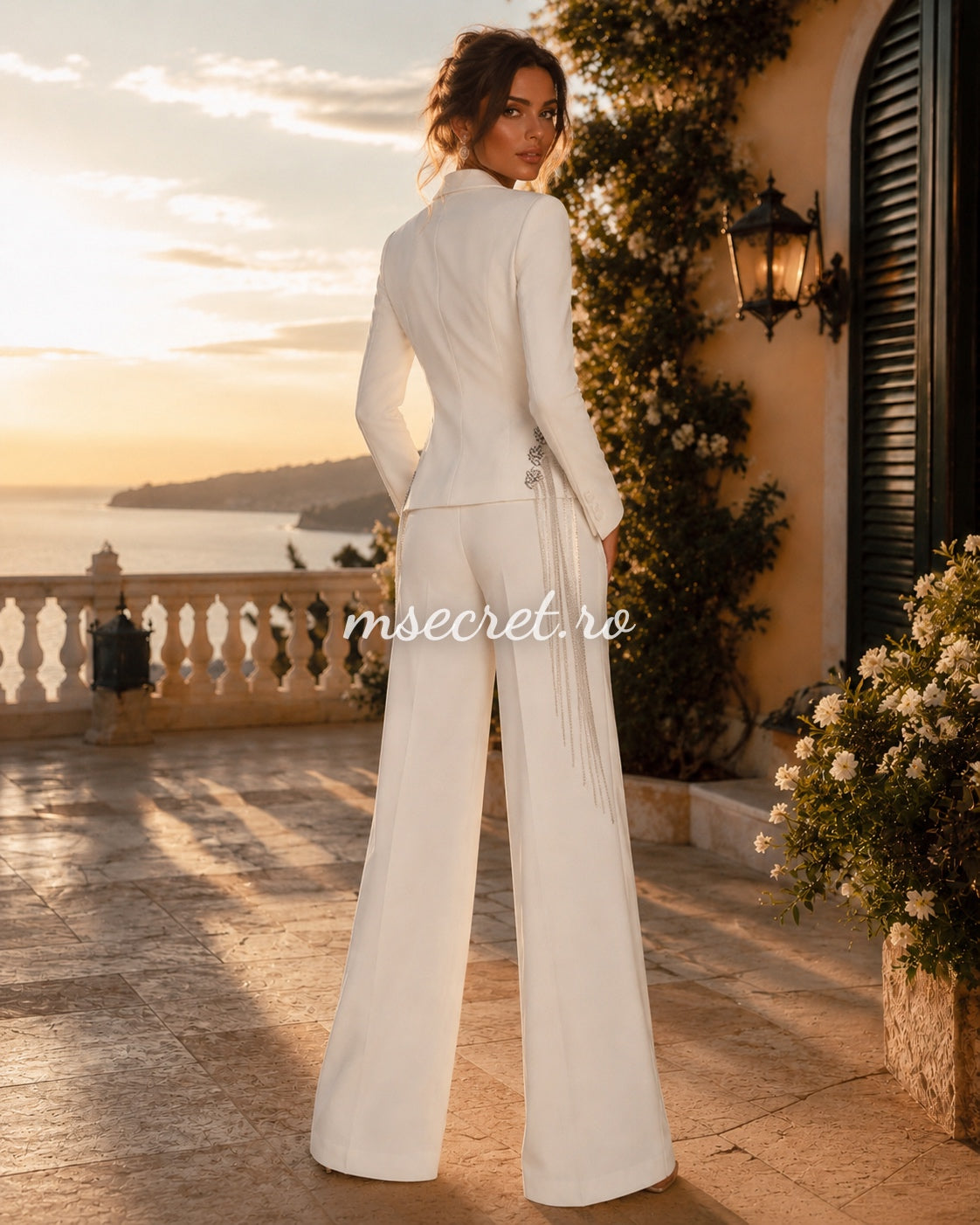 Elegant white suit with a blazer and flared trousers