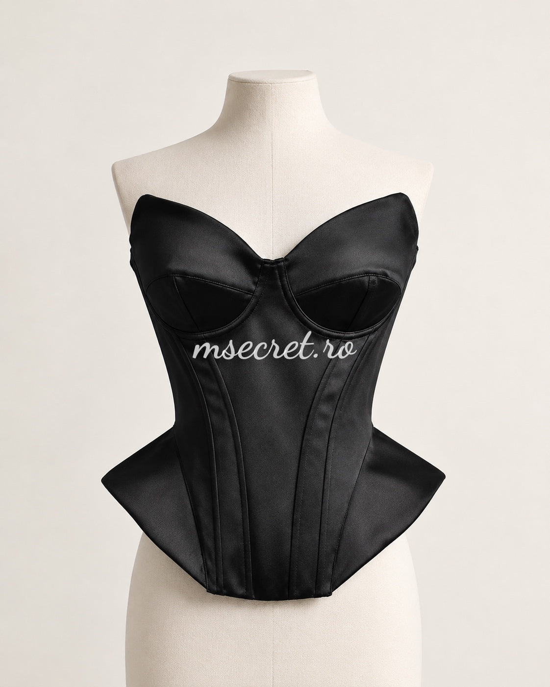 Black satin corset with contoured cups and sculptural design