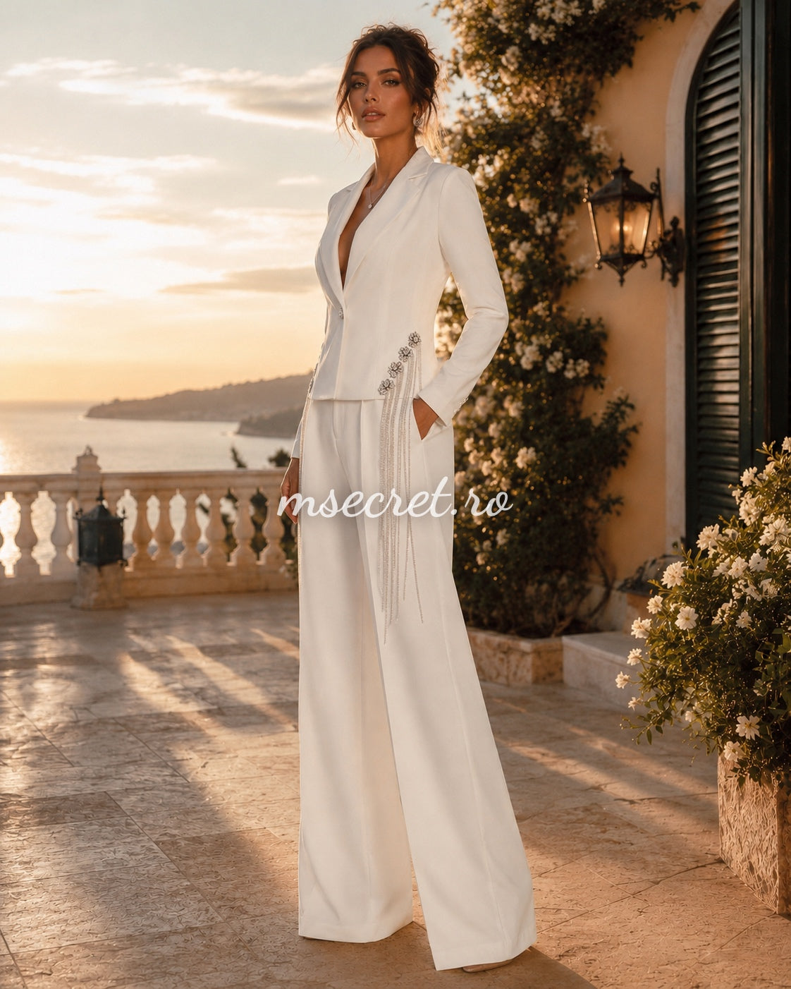 Elegant white suit with a blazer and flared trousers