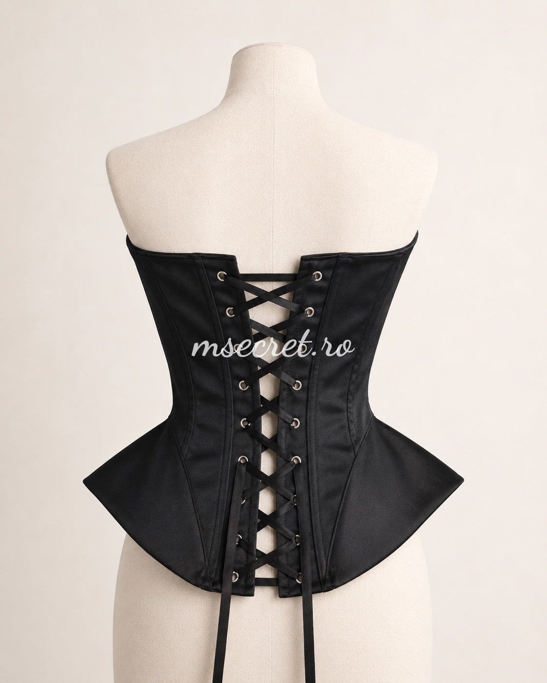 Black satin corset with contoured cups and sculptural design